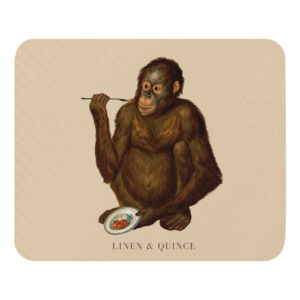 Mouse pad with eating orangutan motif